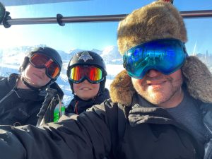 Zack Lewis on a ski lift with his sons.